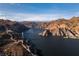 Aerial view of the vast Nevada landscape featuring a lake, rock formations, and a bridge at 617 6Th St, Boulder City, NV 89005
