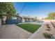 Landscaped backyard featuring new turf, an in-ground pool, and stone walkways at 617 6Th St, Boulder City, NV 89005