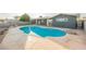 Private backyard with large in-ground pool, concrete patio, and mature landscaping at 617 6Th St, Boulder City, NV 89005