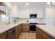 Updated kitchen with modern appliances, quartz countertops, and stylish cabinetry at 617 6Th St, Boulder City, NV 89005