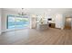 Spacious open-concept living room with updated kitchen and access to backyard pool and patio at 617 6Th St, Boulder City, NV 89005