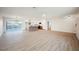 Open concept living room featuring vinyl flooring and access to backyard and updated kitchen at 617 6Th St, Boulder City, NV 89005