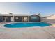 Inviting backyard pool, perfect for relaxation, with modern grey home at 617 6Th St, Boulder City, NV 89005
