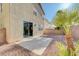 A private backyard featuring desert landscaping, a concrete patio, and privacy walls at 6264 Canebrake Ct, Las Vegas, NV 89141