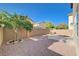 A private backyard featuring desert landscaping, a concrete patio, and privacy walls at 6264 Canebrake Ct, Las Vegas, NV 89141
