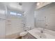 Bright bathroom featuring single sink vanity, shower-tub combo, and modern fixtures at 6264 Canebrake Ct, Las Vegas, NV 89141