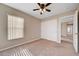 Neutral bedroom featuring a window with blinds, closet, and neutral carpeting at 6264 Canebrake Ct, Las Vegas, NV 89141