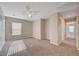 Spacious carpeted bedroom featuring neutral paint and ample natural light from the window at 6264 Canebrake Ct, Las Vegas, NV 89141