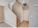 Entryway view with carpeted stairs, wood-look floors, and neutral paint at 6264 Canebrake Ct, Las Vegas, NV 89141