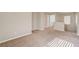 Carpeted hallway with a laundry area featuring white washer and dryer units at 6264 Canebrake Ct, Las Vegas, NV 89141