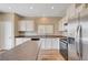 Well-lit kitchen featuring stainless steel appliances, white cabinetry, and a contrasting countertop at 6264 Canebrake Ct, Las Vegas, NV 89141