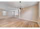Open living space featuring stylish floors, neutral walls, and a modern light fixture at 6264 Canebrake Ct, Las Vegas, NV 89141