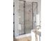 Modern bathroom featuring a glass-enclosed shower with dual shower heads and white marble tiling at 68 Sun Glow Ln, Las Vegas, NV 89135