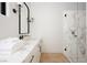 Contemporary bathroom featuring a glass enclosed shower, marble countertops, and modern fixtures at 68 Sun Glow Ln, Las Vegas, NV 89135