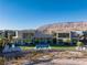 Modern home with a pool, landscaped yard and mountain views at 68 Sun Glow Ln, Las Vegas, NV 89135