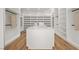 Spacious walk-in closet with custom shelves, drawers, and center island for optimal storage at 68 Sun Glow Ln, Las Vegas, NV 89135