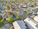 Expansive neighborhood view featuring homes with private pools, lush greenery, and ample backyard space at 6909 Fruit Flower Ave, Las Vegas, NV 89130
