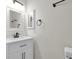 Bathroom with white vanity, dark hardware and lighting at 6909 Fruit Flower Ave, Las Vegas, NV 89130