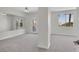 Spacious bedroom features carpet, a ceiling fan, and access to a mirrored gym or flex space at 6909 Fruit Flower Ave, Las Vegas, NV 89130