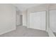 Bedroom featuring neutral carpet and large closet doors at 6909 Fruit Flower Ave, Las Vegas, NV 89130