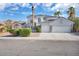 Charming two-story home with a three car garage and well-manicured landscaping at 6909 Fruit Flower Ave, Las Vegas, NV 89130