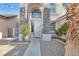 Charming home featuring a decorative stone pillars at the front entrance and desert landscaping at 6909 Fruit Flower Ave, Las Vegas, NV 89130