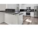 Kitchen featuring breakfast bar, stainless steel appliances, white cabinets and granite counters at 6909 Fruit Flower Ave, Las Vegas, NV 89130