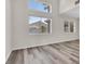 Bright living room featuring hardwood floors and large windows at 6909 Fruit Flower Ave, Las Vegas, NV 89130