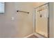 Bathroom featuring a glass enclosed standing shower and neutral colored walls at 6916 Gothic Marigold St, Las Vegas, NV 89149