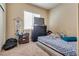 Neutral bedroom featuring carpet, large dresser, and lots of natural light at 6916 Gothic Marigold St, Las Vegas, NV 89149