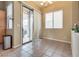 Bright dining area featuring tile flooring and sliding glass doors to the backyard at 6916 Gothic Marigold St, Las Vegas, NV 89149