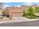 Charming one-story home with a well-maintained front yard and a two-car garage at 6916 Gothic Marigold St, Las Vegas, NV 89149