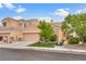 Single-Gathering home featuring desert landscaping, mature trees, and two-car garage at 6916 Gothic Marigold St, Las Vegas, NV 89149