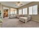 Bright living room features neutral tones, plush carpeting, and a comfortable sectional sofa at 6916 Gothic Marigold St, Las Vegas, NV 89149