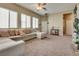 Spacious living room with large sectional sofa and a view of the front entrance at 6916 Gothic Marigold St, Las Vegas, NV 89149