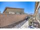 Private backyard space with brick walls and patio area at 7472 Garnet Moon St, North Las Vegas, NV 89084