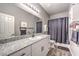 Bathroom highlighting granite countertops, updated fixtures, and modern finishes at 7472 Garnet Moon St, North Las Vegas, NV 89084