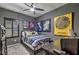 Bedroom showcasing a modern ceiling fan, shuttered window, and contemporary decor at 7472 Garnet Moon St, North Las Vegas, NV 89084