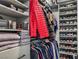 Organized walk-in closet featuring built-in shelves, hanging racks, and shoe storage at 7472 Garnet Moon St, North Las Vegas, NV 89084