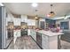 Modern kitchen with stainless steel appliances, granite countertops, and stylish backsplash with an open floor concept at 7472 Garnet Moon St, North Las Vegas, NV 89084