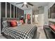 Bedroom with a black and white accent wall, ensuite bathroom, and walk-in closet for modern living at 7472 Garnet Moon St, North Las Vegas, NV 89084