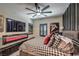 Stylish bedroom with an accent wall, modern lighting, and sleek decor, creating a cozy and inviting space at 7472 Garnet Moon St, North Las Vegas, NV 89084