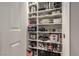 Organized pantry with shelving, providing ample storage space for kitchen essentials and cookware at 7472 Garnet Moon St, North Las Vegas, NV 89084