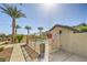 Community pool area with fencing and palm trees providing a refreshing amenity for residents at 7472 Garnet Moon St, North Las Vegas, NV 89084