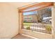 A cozy balcony with a view of the building's exterior and well-maintained grassy lawn at 7885 W Flamingo Rd # 1131, Las Vegas, NV 89147