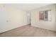 A bedroom is brightly lit with a closet, window, and light wood-look flooring at 7885 W Flamingo Rd # 1131, Las Vegas, NV 89147