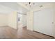 A bedroom showcases light wood-look floors and access to another room at 7885 W Flamingo Rd # 1131, Las Vegas, NV 89147