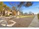 An exterior shot of a building with mature trees, lawn, picnic benches and manicured bushes at 7885 W Flamingo Rd # 1131, Las Vegas, NV 89147