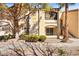 Exterior view of building with mature trees, lawn, and manicured bushes at 7885 W Flamingo Rd # 1131, Las Vegas, NV 89147