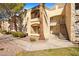 Exterior view of building with mature trees, lawn, and manicured bushes at 7885 W Flamingo Rd # 1131, Las Vegas, NV 89147